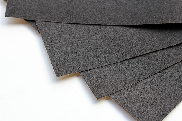 Photo black sandpaper on a white background