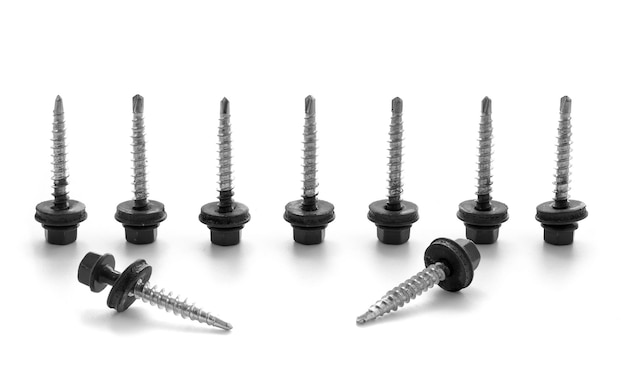 Black screws on metal isolated on white background Screws for roofing material