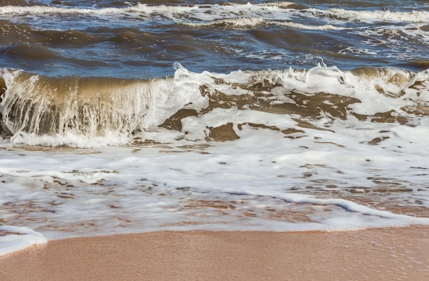 The Black Sea in sunny weather Surf on the beach wavessandy shore