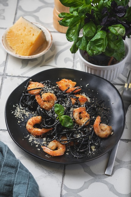 Black shrimp pasta with olive oil and parmesan