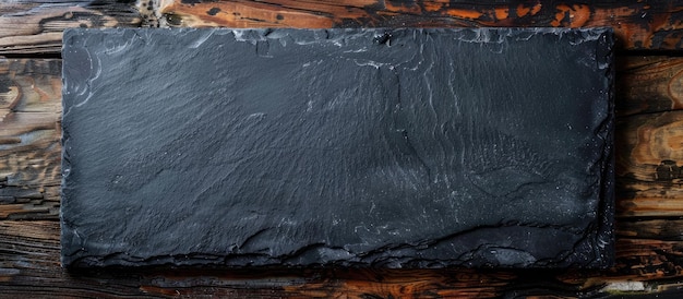 Photo black slate board for serving with copy space seen from above