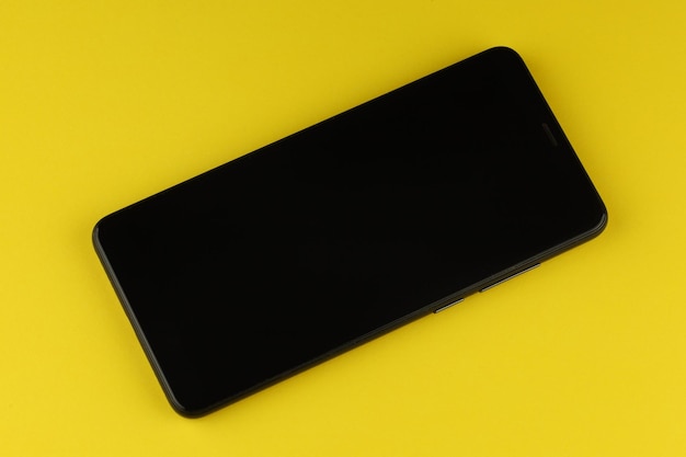 Black smartphone on a colored background