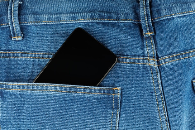 Black smartphone in pants pocket