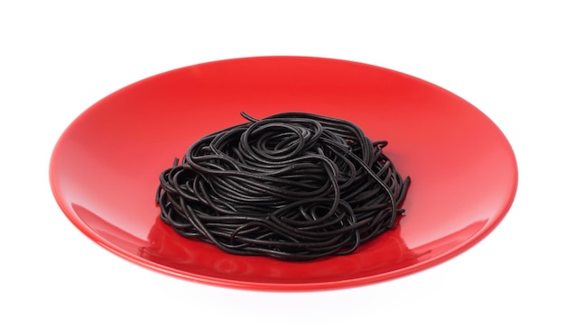 Black spaghetti in red dish isolated on white background