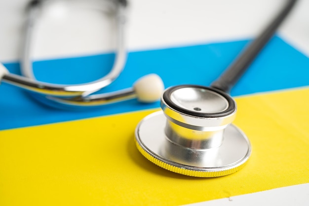 Black stethoscope on Ukraine flag background Business and finance concept