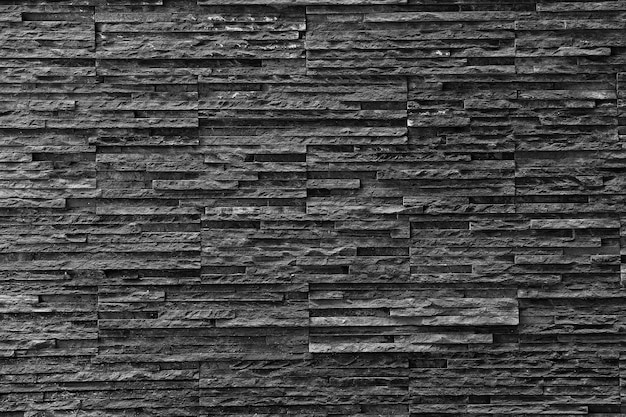 Black stone wall Texture in weathered and have natural surfaces