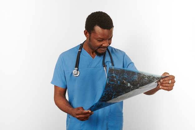 Black surgeon doctor bearded man in blue coat with crossed arms isolated white background copy space