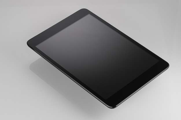 Black tablet on a white background light closeup