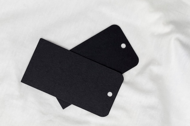 Black tags on cotton material