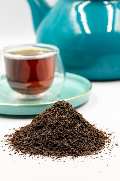 Black tea isolated on a white background close up