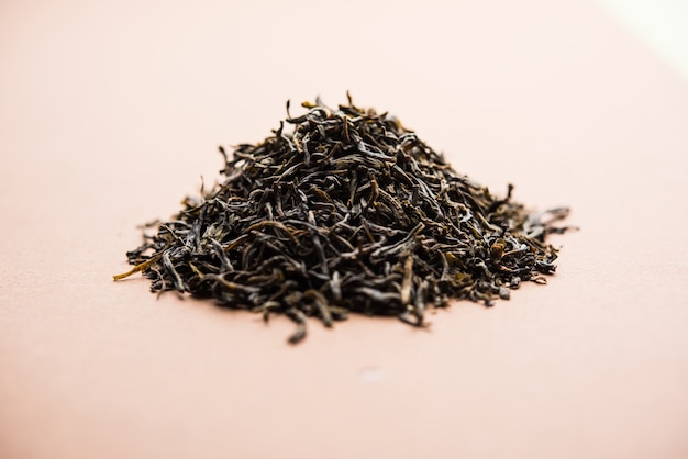 Black Tea Powder or dry dust with or without green leaf and served hot chai in a cup