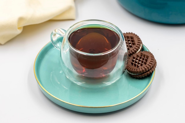 Black tea on a white background Turkish tea brewed with hot water close up