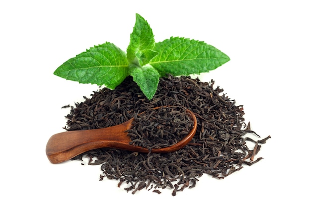 Black tea with mint and a wooden spoon