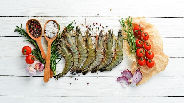 Black tiger prawns with lemon Seafood Top view On a white wooden background Free copy space