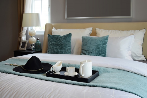 Black tray of tea set in classic style bedroom at home