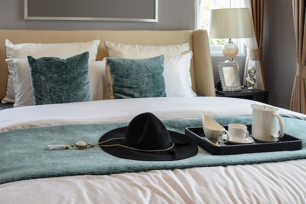 Black tray of tea set in classic style bedroom at home