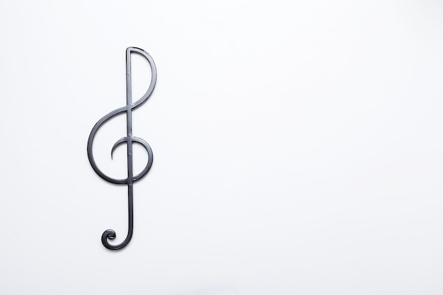 Photo black treble clef on a white background music symbol