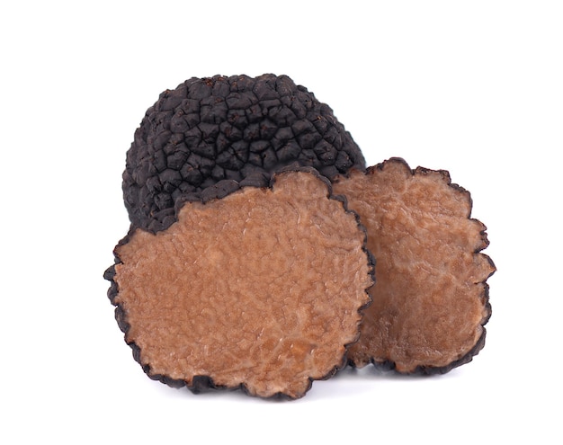 Black truffles isolated on a white background Fresh sliced truffle Delicacy exclusive truffle mushroom Piquant and fragrant French delicacy Clipping path