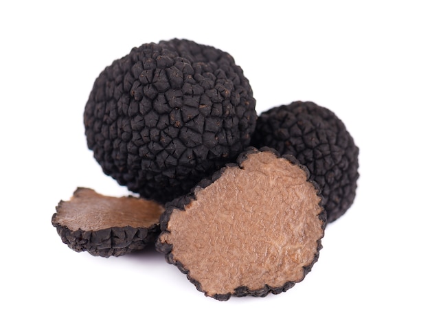 Black truffles isolated on white