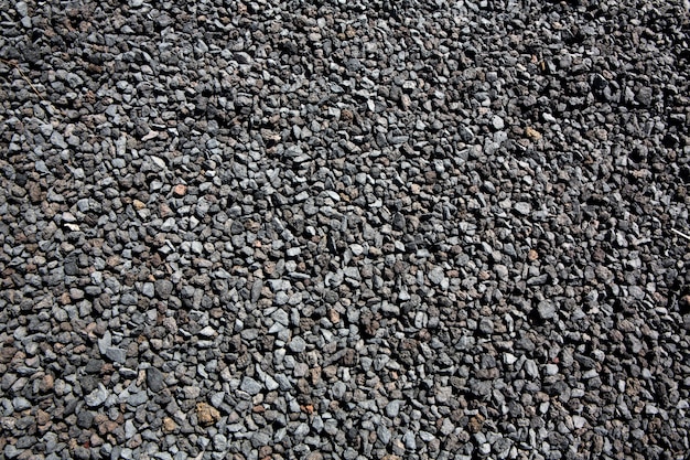 Black volcanic lava stones pattern texture