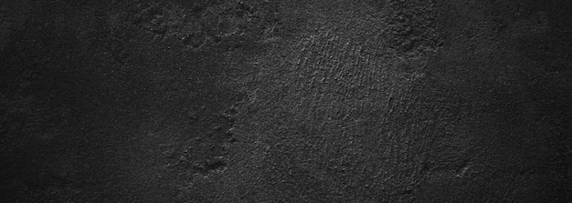 Black wall scary or dark gray rough grainy stone texture background Black concrete for background