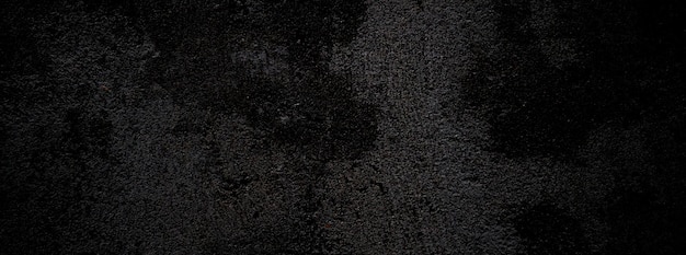 Black wall scary or dark gray rough grainy stone texture background Black concrete for background