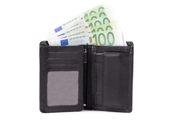 A black wallet with 100 euro bills on it.