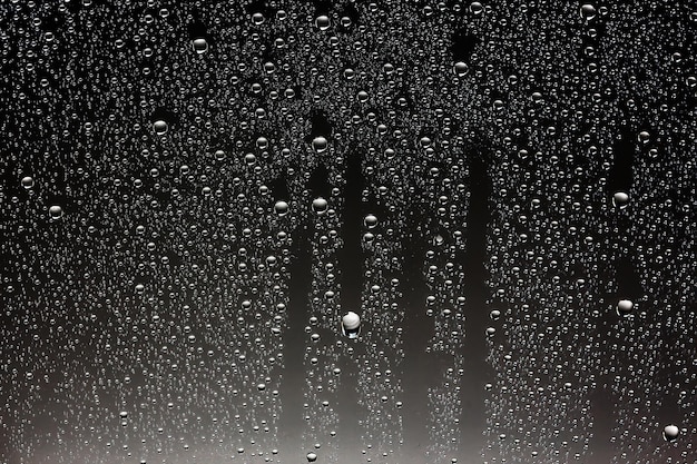 black wet background / raindrops for overlaying on window, concept of autumn weather, background of drops of water rain on glass transparent