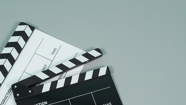 Black and white Clapperboard or clapper board or movie slate use in video production ,film, cinema industry on gray background.