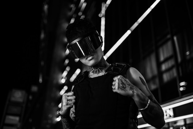 Black and white cyberpunk the guy in stylish glasses man in the night city high quality photo