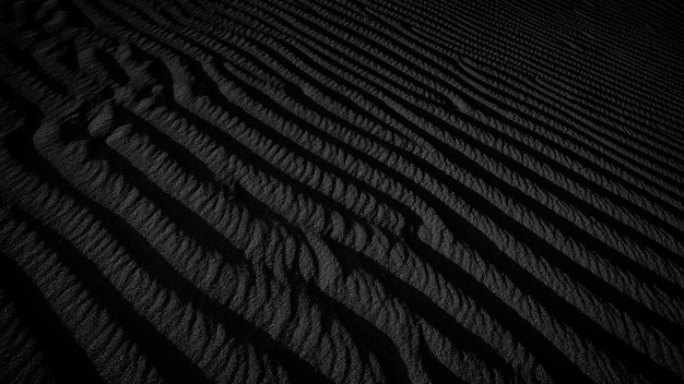 Black and white dark texture of desert sand dunes