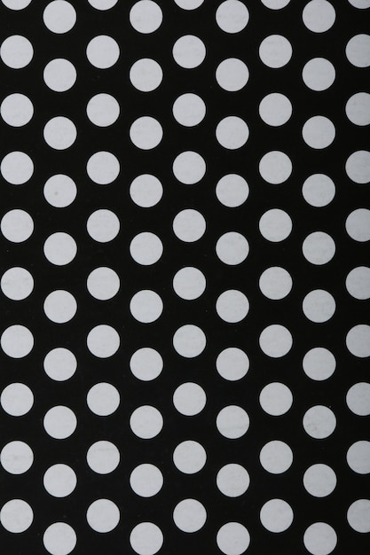 Black and white decorative pattern texture with repeating balls..