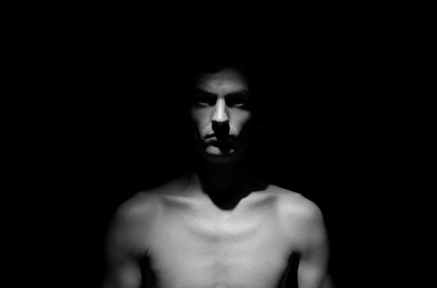 Black and white dramatic photo of a man