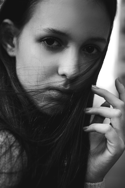 Black and white fashion portrait of a young girl.