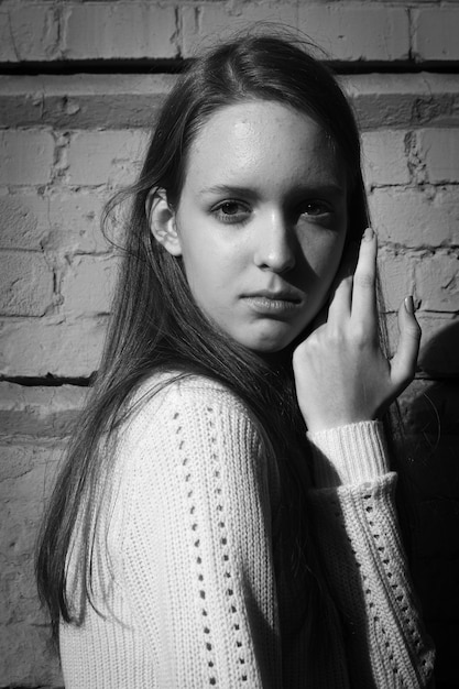 Black and white fashion portrait of a young girl.