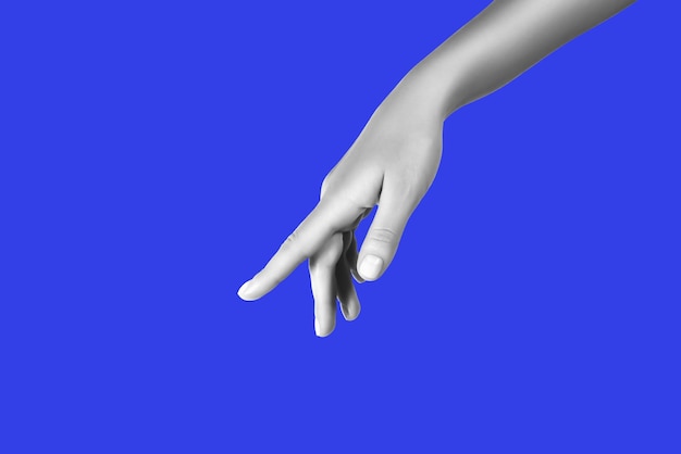 black and white hand pointing finger down on blue background