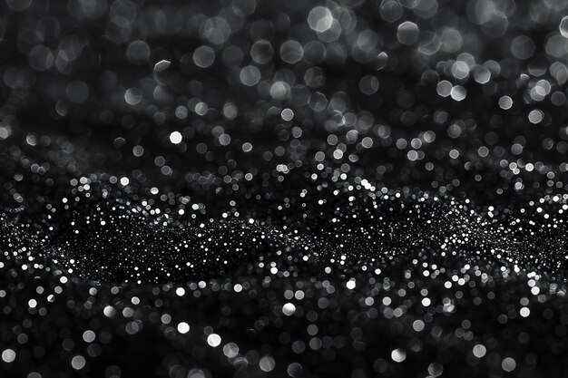 Photo a black and white photo of a black background with glitters