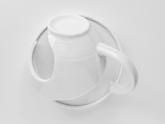 Black and white photo broken cup minimalism white on white art background