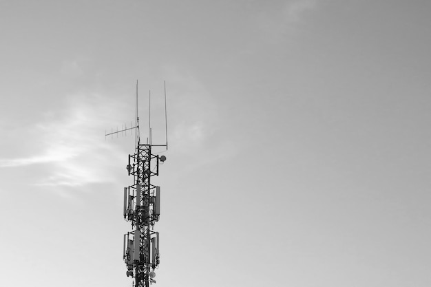 Black and white photo Cell tower against the sky Modern technologies