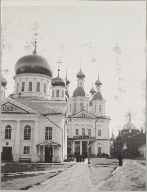 a black and white photo of a church with a church in the background