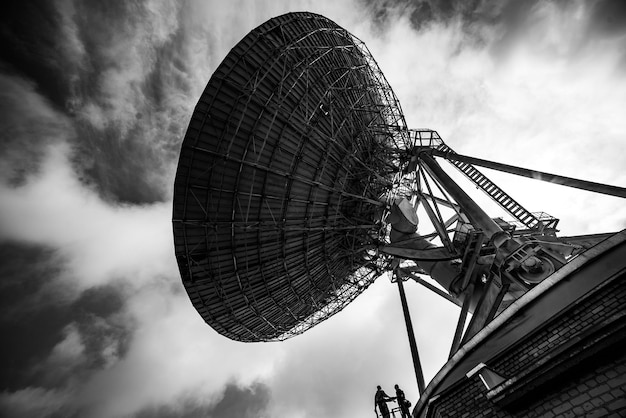 Photo a black and white photo of a large antenna with the words radio on it.