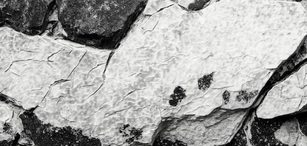 A black and white photo of a rock with a black and white photo of a rock with the words'black and white'on it.