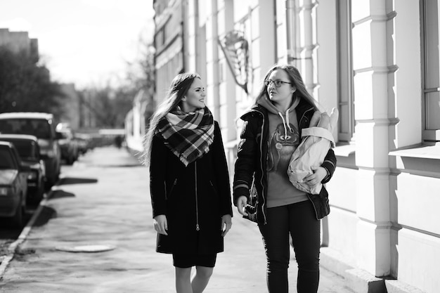 Black and white photo of a young girl on a walk