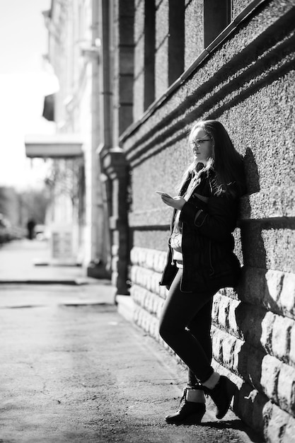 Black and white photo of a young girl on a walk