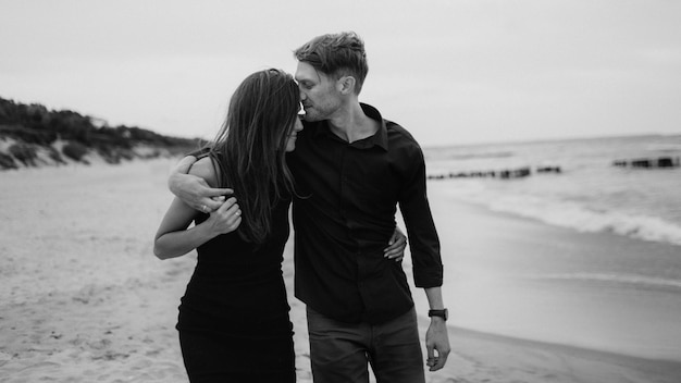 Black and white picture of kissing couple