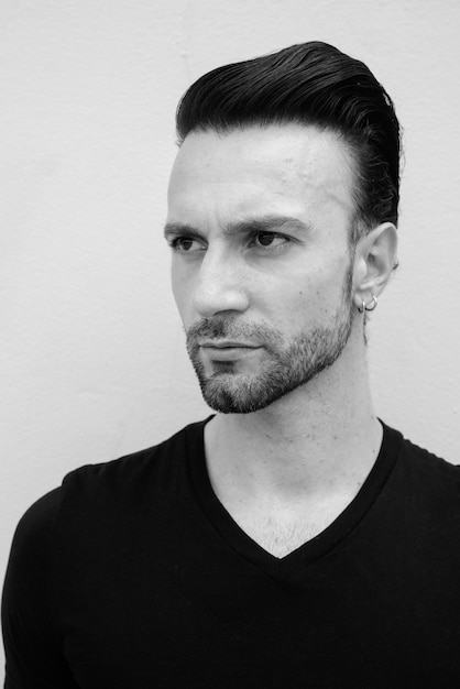 Black and white portrait of handsome Italian man thinking