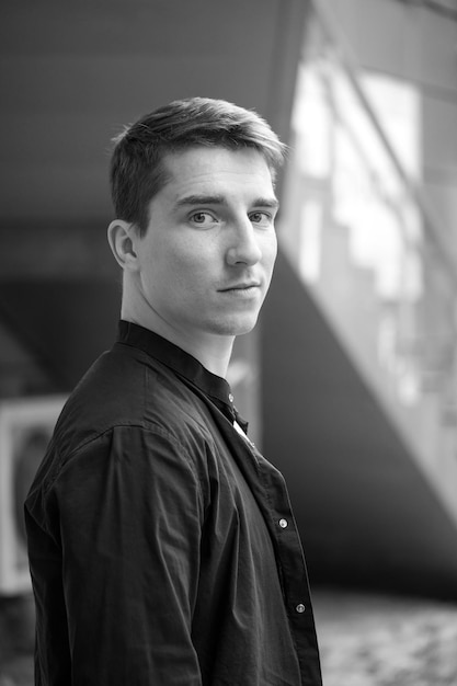 Black and white portrait of a young handsome guy