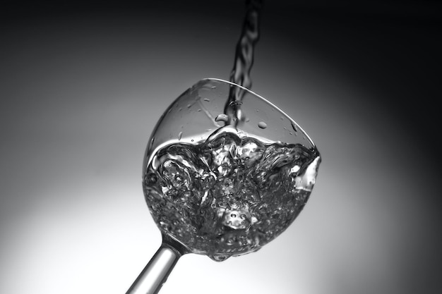 Black and white shot of a glass full of water