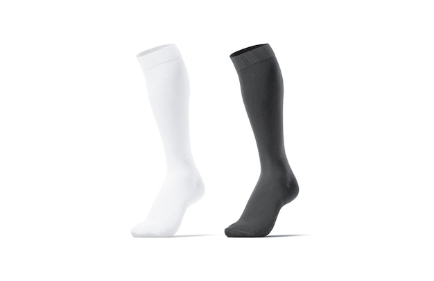 Black and white soccer socks toe half-turned. Elastic knickerbockers or stockings. Clear football.