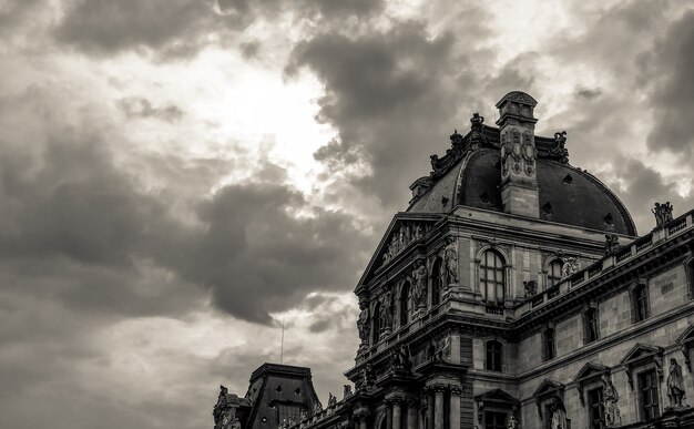 The black and white top of Louvre museum in the sky Paris September 2017